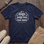 Navy dog lover t-shirt with Dogs Judge Less Love More slogan in pink botanical paw print design by Fetchkind