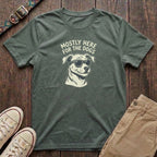 Military green funny dog lover t-shirt with Mostly Here for the Dogs slogan and cool dog in sunglasses illustration by Fetchkind
