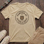 Natural dog lover t-shirt with Powered by Caffeine and Canines distressed stamp badge and coffee paw print design by Fetchkind