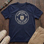 Navy dog lover t-shirt with Powered by Caffeine and Canines distressed stamp badge and coffee paw print design by Fetchkind