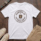 White dog lover t-shirt with Powered by Caffeine and Canines distressed stamp badge and coffee paw print design by Fetchkind