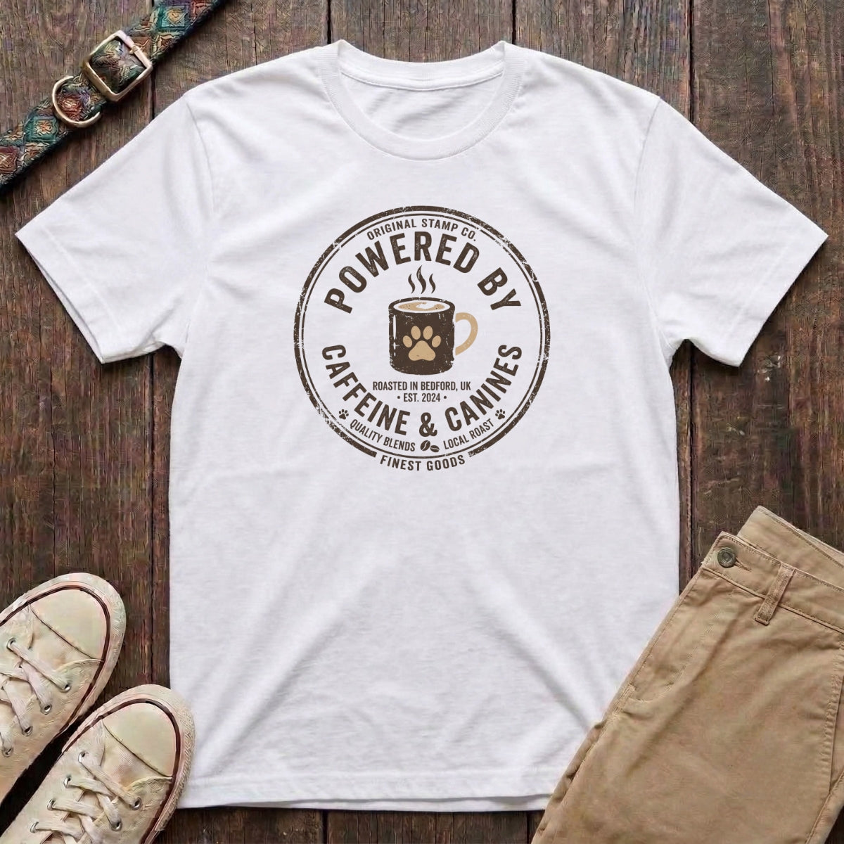 White dog lover t-shirt with Powered by Caffeine and Canines distressed stamp badge and coffee paw print design by Fetchkind